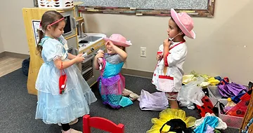 Kids playing at toy kitchen