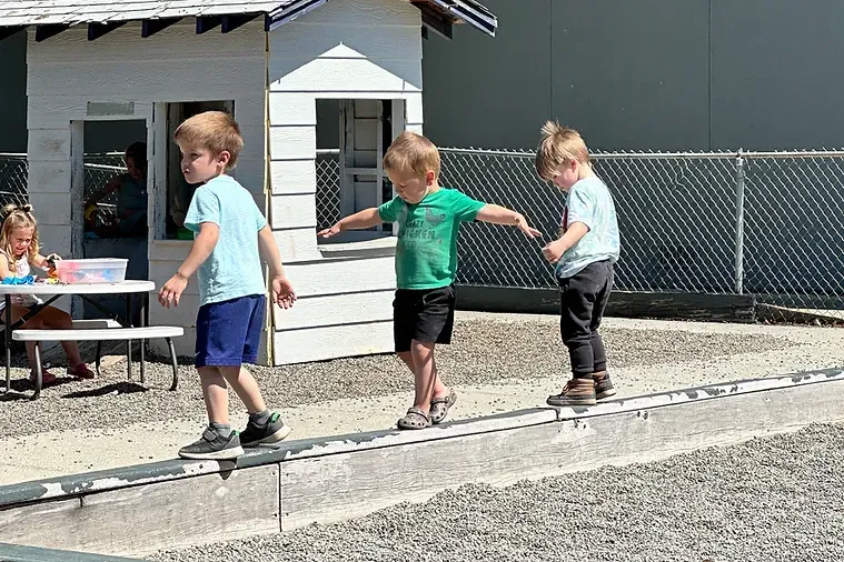 kids balancing at the playground.