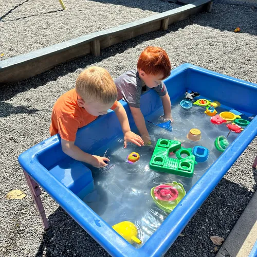 Kids playing at a water table